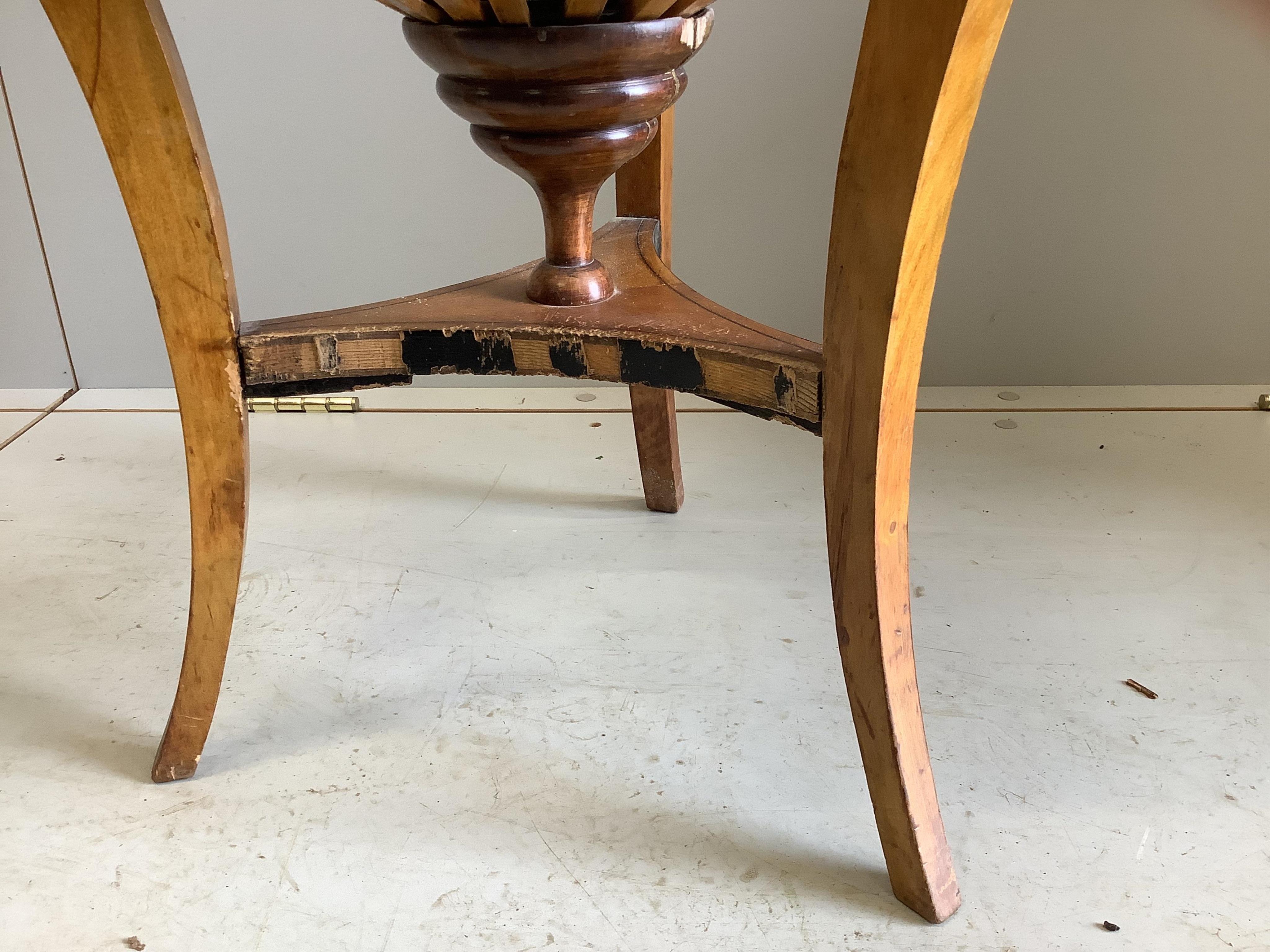 A 19th century Swedish Biedermeier circular birch work table, diameter 50cm, height 74cm. Condition - fair